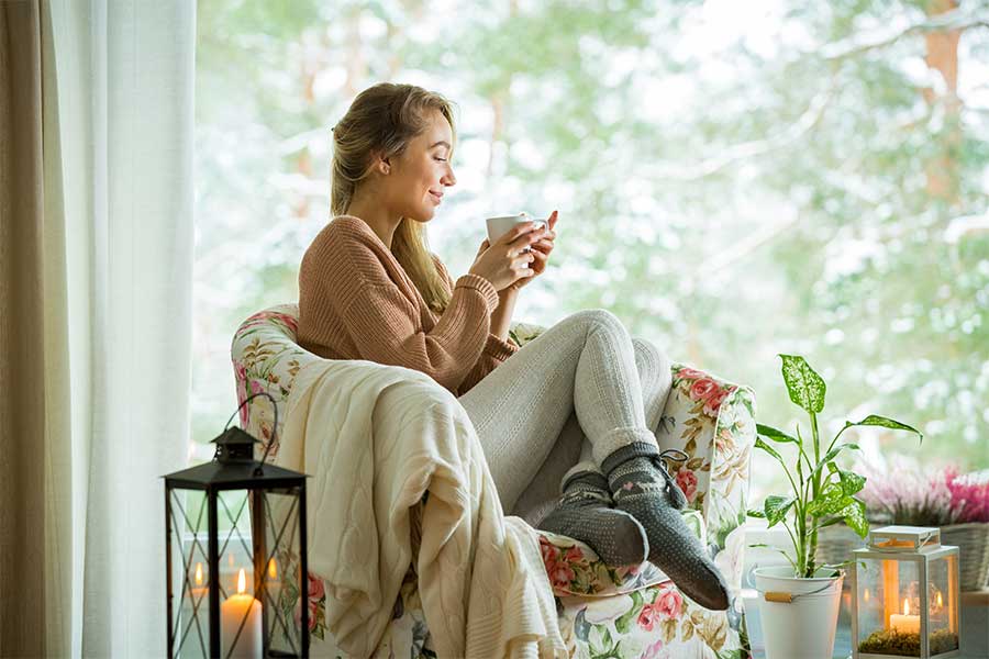 woman living cozy on a chair